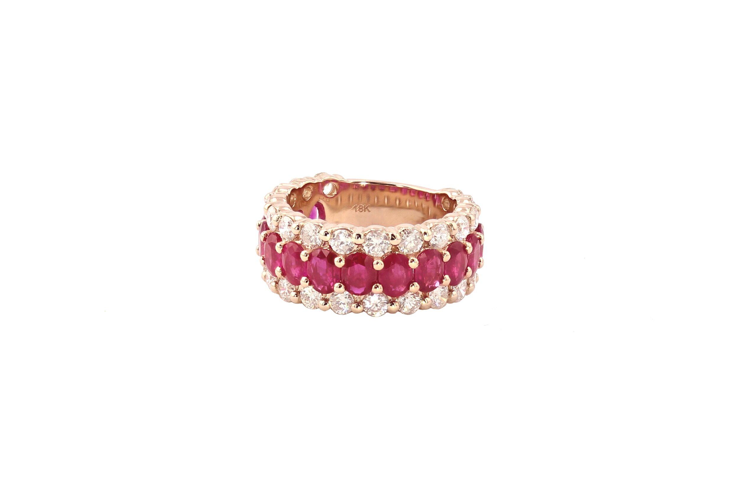 Gorgeous Statement Ring featuring with beautiful Oval Cut Rubies (3.87 ctw.) and Round Brilliant Cut Diamonds 1(2.27 ctw.), set in 18K Rose Gold. $9500